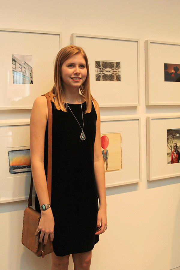 Senior Maridee Weber stands for a picture in front of her two-dimensional drawing titled Airhead at the Shooting Stars recognition at Johnson County Community College on Sunday, March 29.