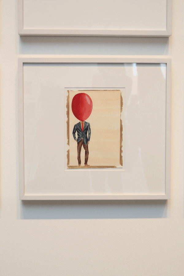 Senior Maridee Webers two- dimensional drawing titled Airhead displayed at Johnson County Community College on Sunday, March 29. The composition consists of Gouache and colored pencil on paper.