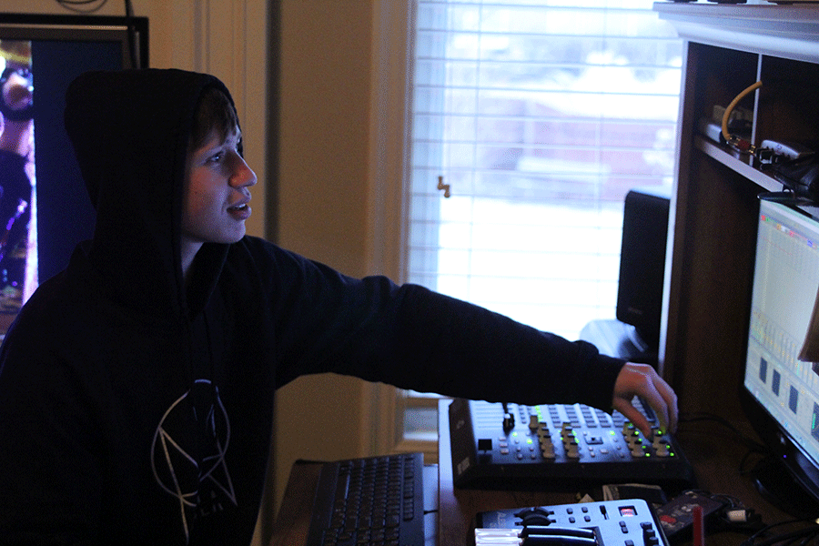 Mixing various songs together, senior Aaron Hieb produces his own music in his room on Thursday, March 5. [My goals are] to get people to listen to [my music], Hieb said. [I want to] make it sound as good as it can. 