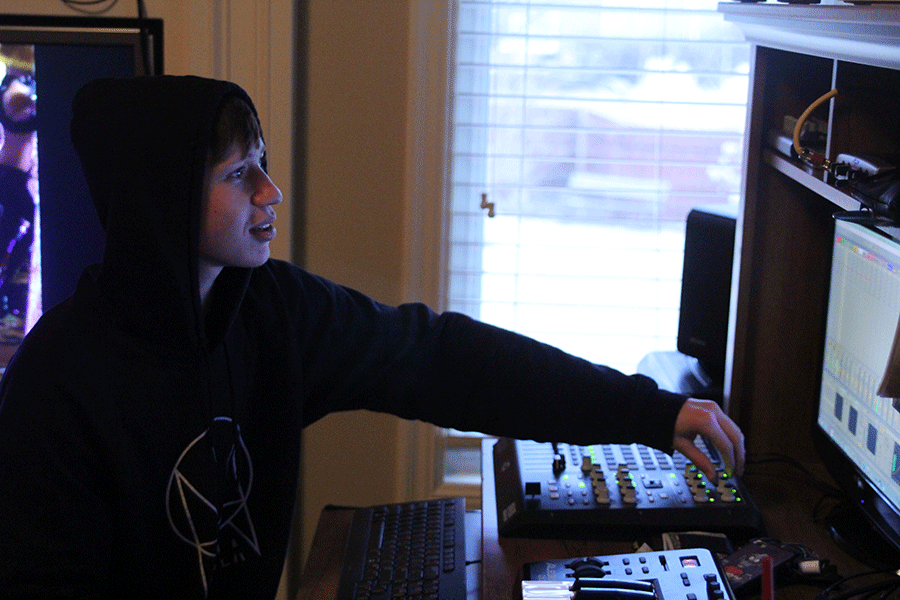 Mixing various songs together, senior Aaron Hieb produces his own music in his room on Thursday, March 5. "[My goals are] to get people to listen to [my music]," Hieb said. "[I want to] make it sound as good as it can." 