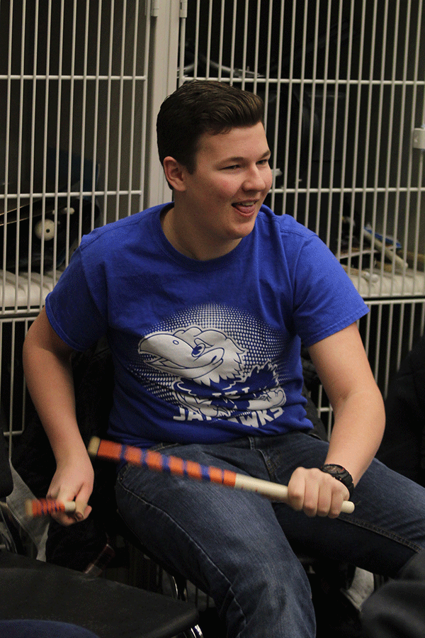  Junior Spencer Hamilton drums with his fellow percussionist on Friday, Feb. 27. “[In band] you get to meet more people,” Hamilton said. “It is a different place to put myself out there.”