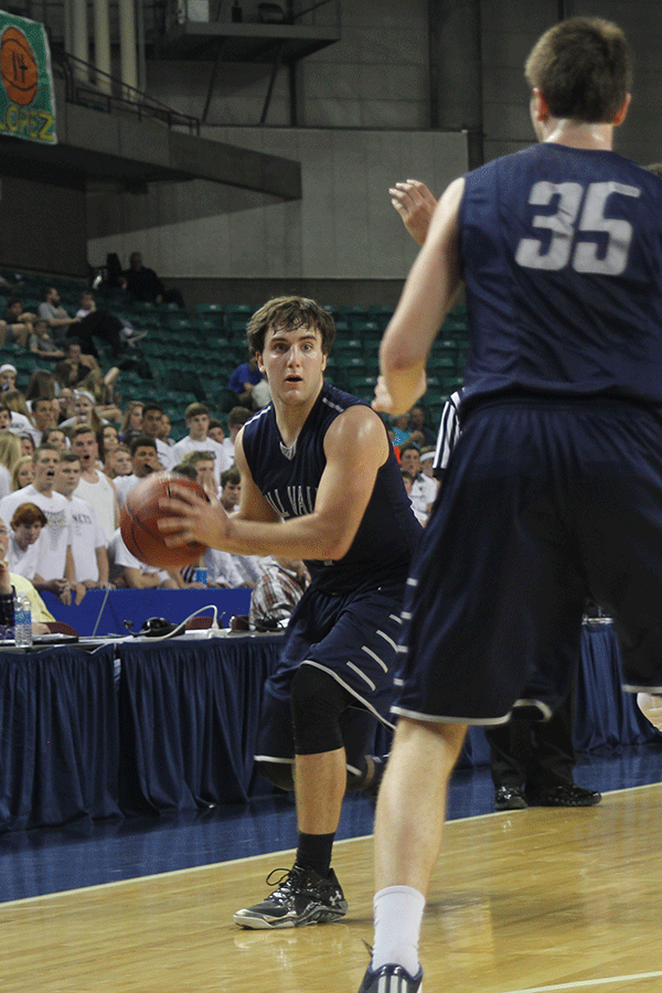 Junior Logan Koch looks to pass to junior Clayton Holmberg.