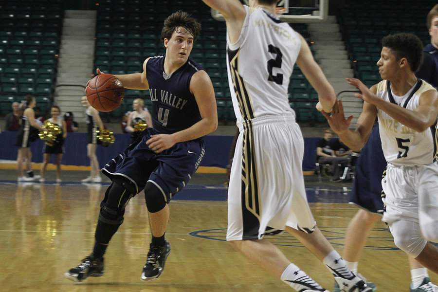 Junior Logan Koch brings the ball down the court. 
