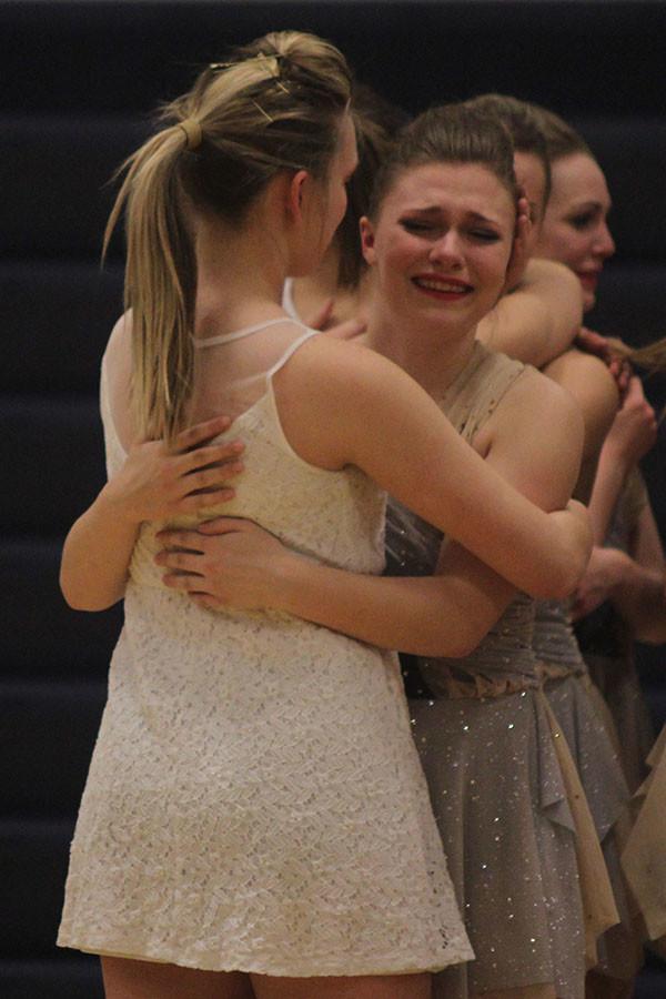 Freshman Jessie Haase says goodbye to senior Joyce Friedel. 