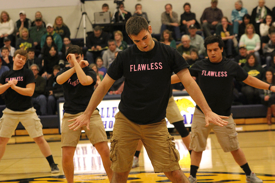 With arms at his sides, senior Eli Stewart strikes a pose.