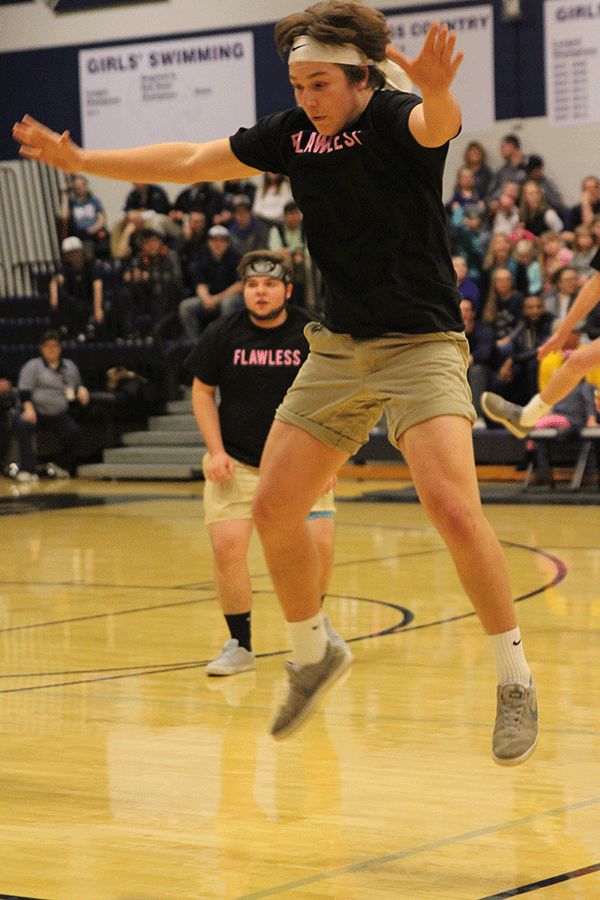 Junior Tyler Shurley jumps up into a toe-touch.