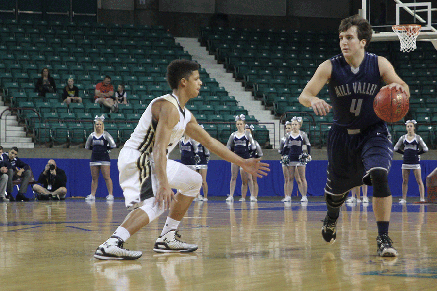 Junior Logan Koch dribbles the ball early in the game. 