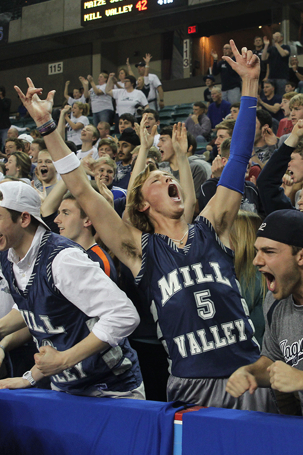 Junior Lucas Krull throws his arms up in the air when Mill Valley trails only by two against Maize South after a 14-point deficit. 