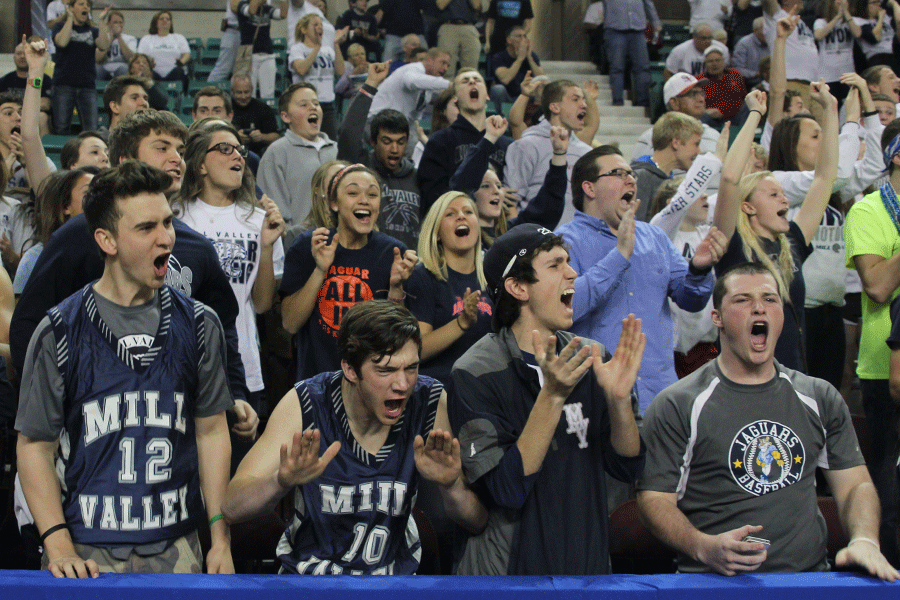 Students cheer at the Topeka Expocentre during the quarterfinal game.