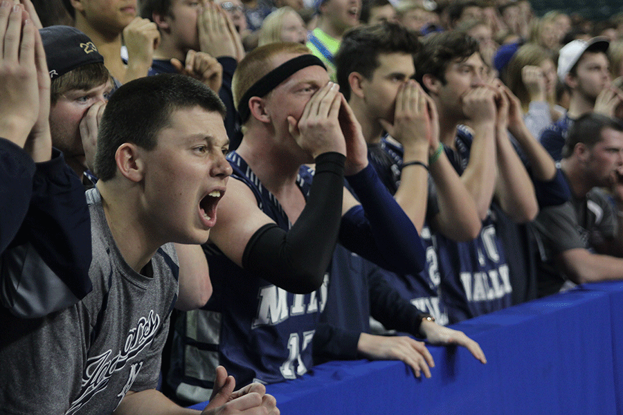 Junior Nick Vitale attempts to distract a Maize South player while he shoots a free throw.