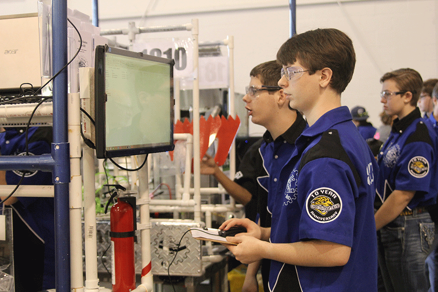 Sophomore Nathan Gawith reviews statistics over other teams robots. 