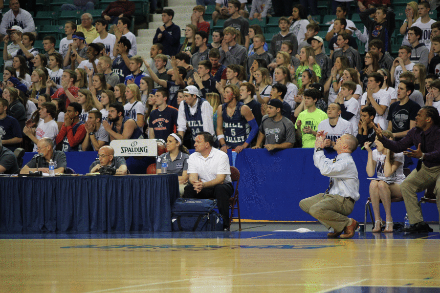 Head coach Mike Bennet and crowd show upset after a call made.