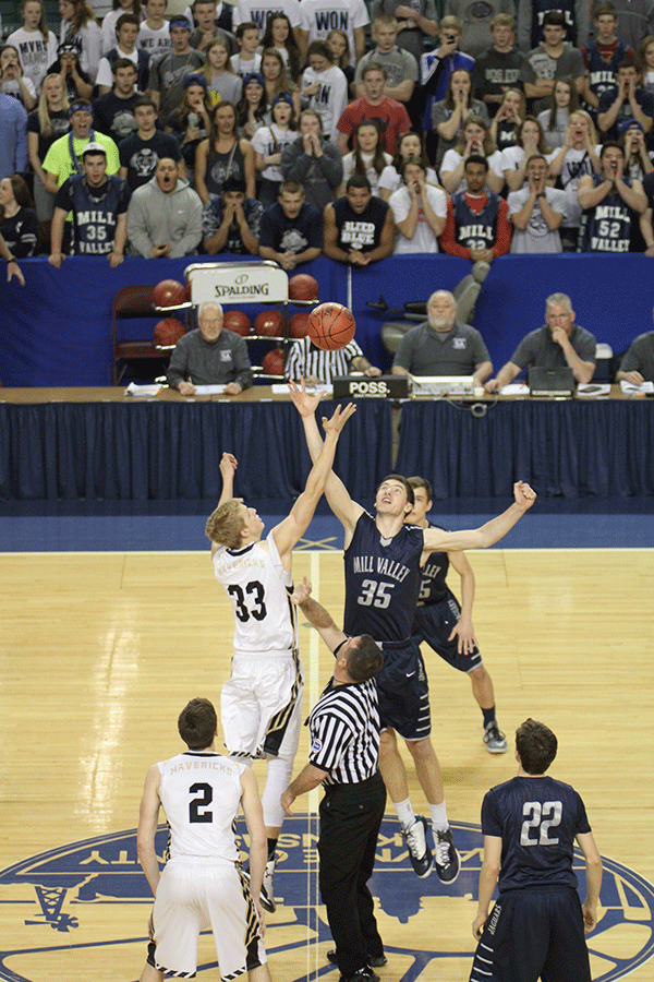 Junior Clayton Holmberg tips off the ball.