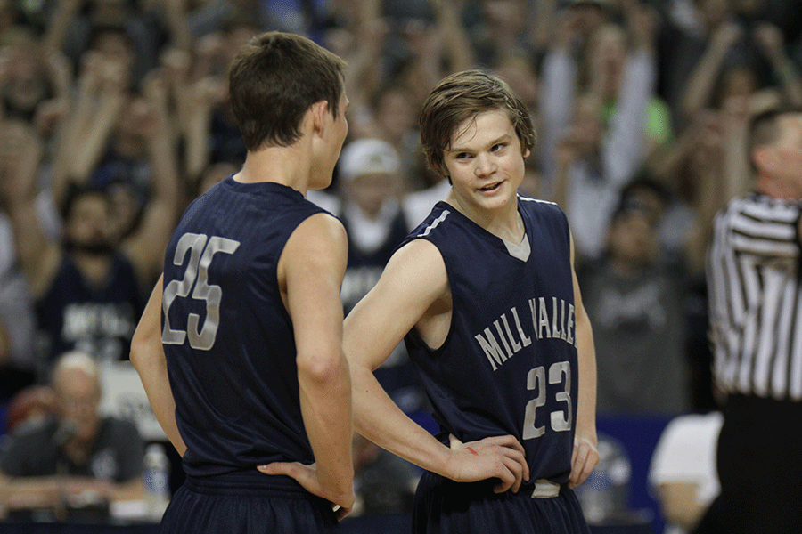 Freshman Cooper Kaifes talks with junior Jaison Widmer. 