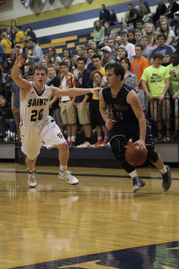 Junior Logan Koch searches for a way to the basket.