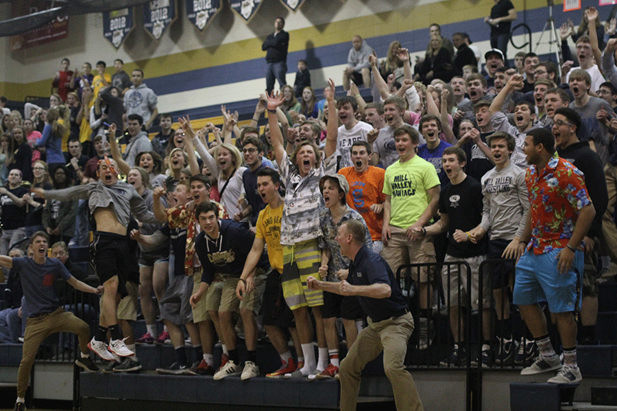 Students, along with athletic director David Ewers, scream in response to the winning shot made by Logan Koch with 7.6 seconds left in the game. 