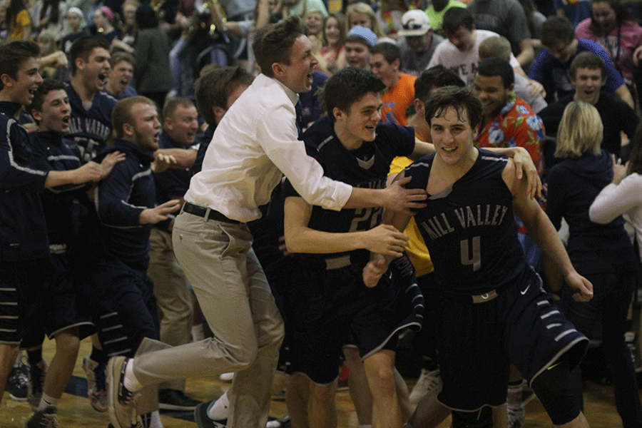 Players are overcome with excitement at the conclusion of the sub-state championship against Aquinas. 