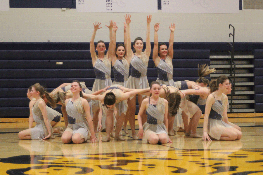 The Silver Stars begin their contemporary routine to the song Radioactive.