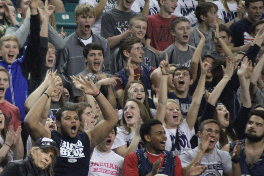 The student section cheers as a basket is made.