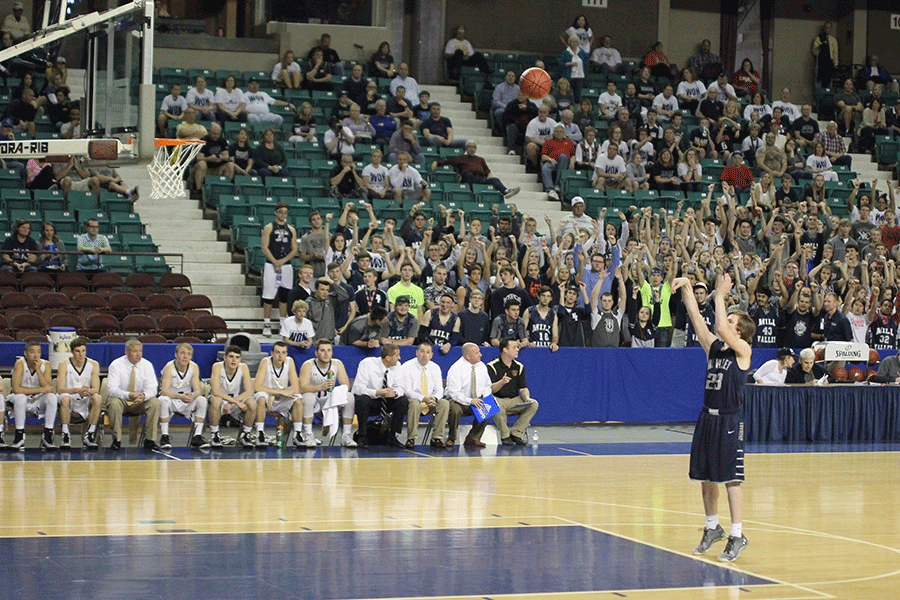 The student section cheers on Cooper Kaifes while he shoots a free throw.