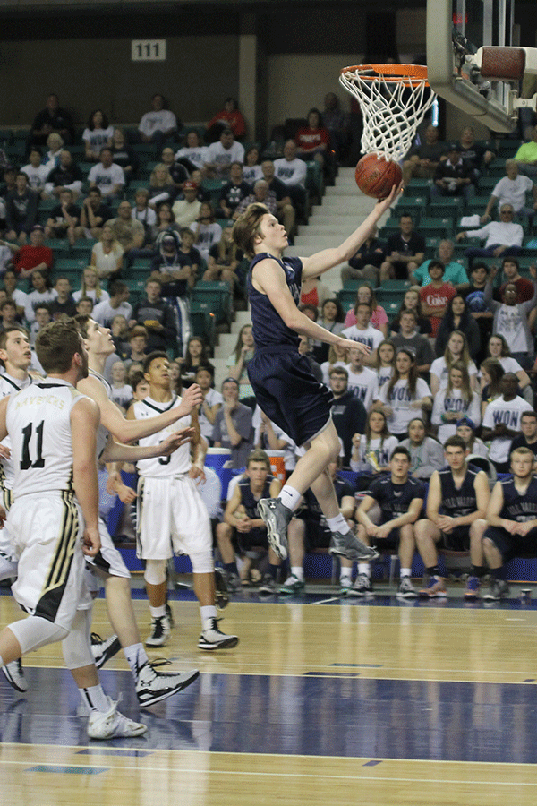 Freshman Cooper Kaifes goes up for a layup.