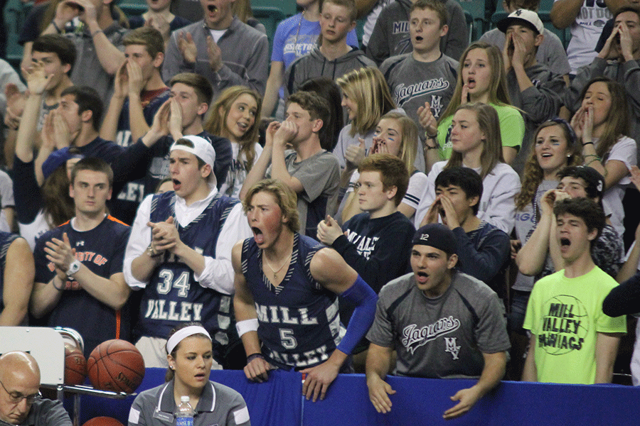 Students cheer on the Jaguars.