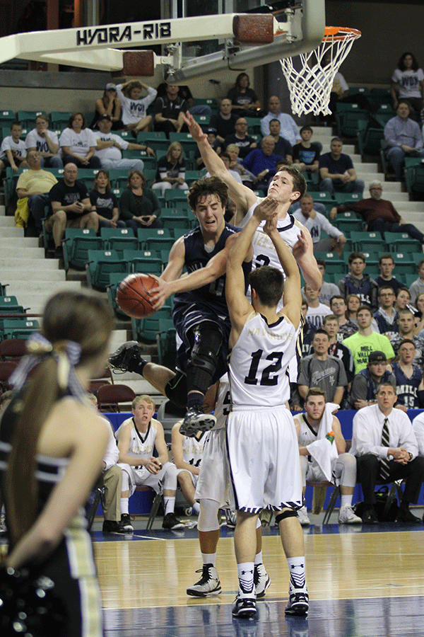 Junior Logan Koch prepares to pass to a teammate after a drive to the basket.