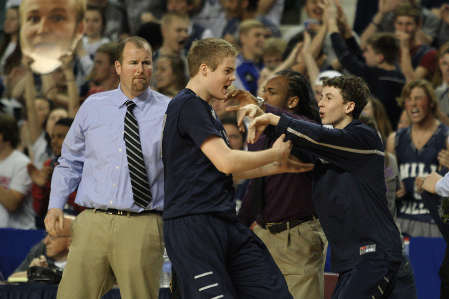 Sophomore Blake Montgomery encourages junior Tyler Grauer during the teams fourth-quarter comeback.