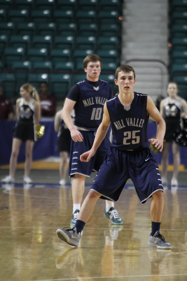 Senior Conner Kaifes and junior Jaison Widmer play defense in the last minute of the game.