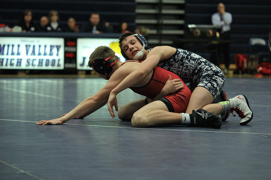 As State runner up in the 106 weight class, sophomore Dylan Gowin pins an opponent at a previous tournament on Thursday, Feb 5 which prepared him for his finishing title.