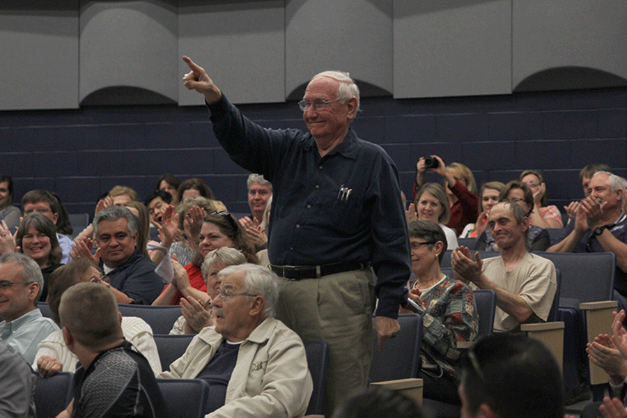 Composer Eugene Butler stands up after The Treble Ladies sings his song for the first time, If Music Be The Food Of Love.