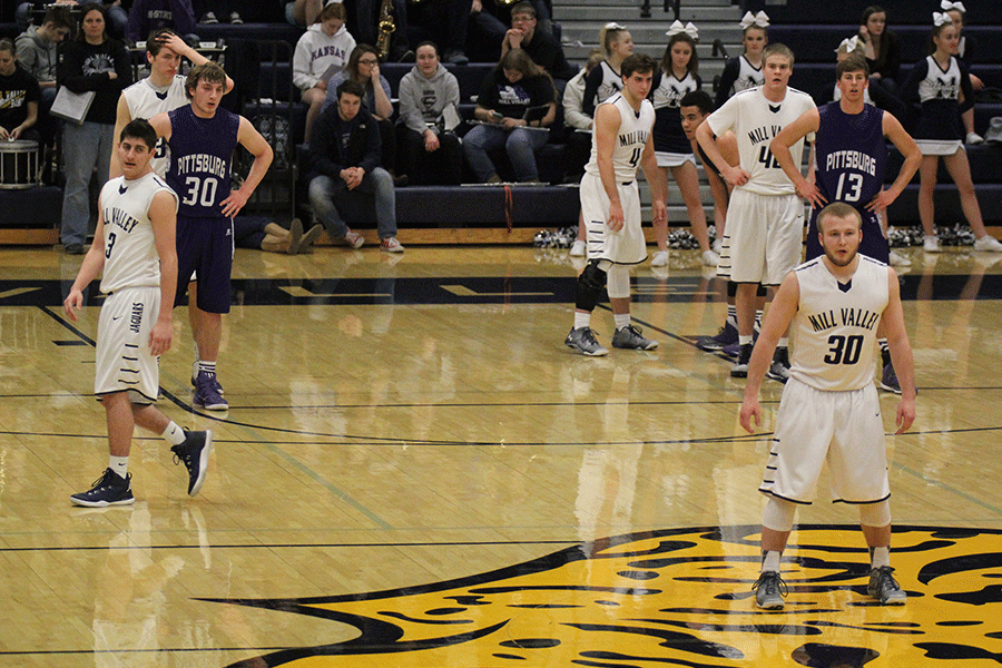 Senior Mitch Perkins leads the team and stands near half court. 