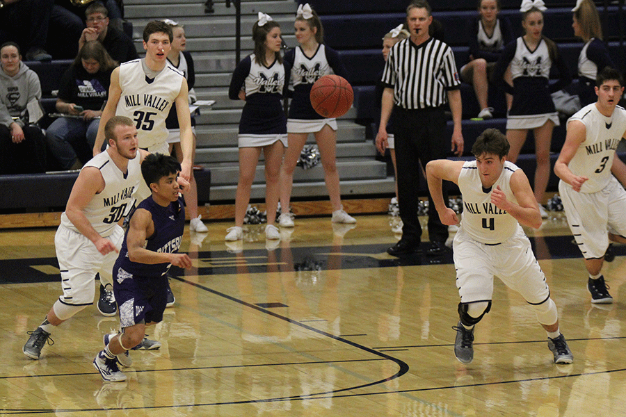 Senior Logan Koch and a player from Pittsburg race to get the ball.