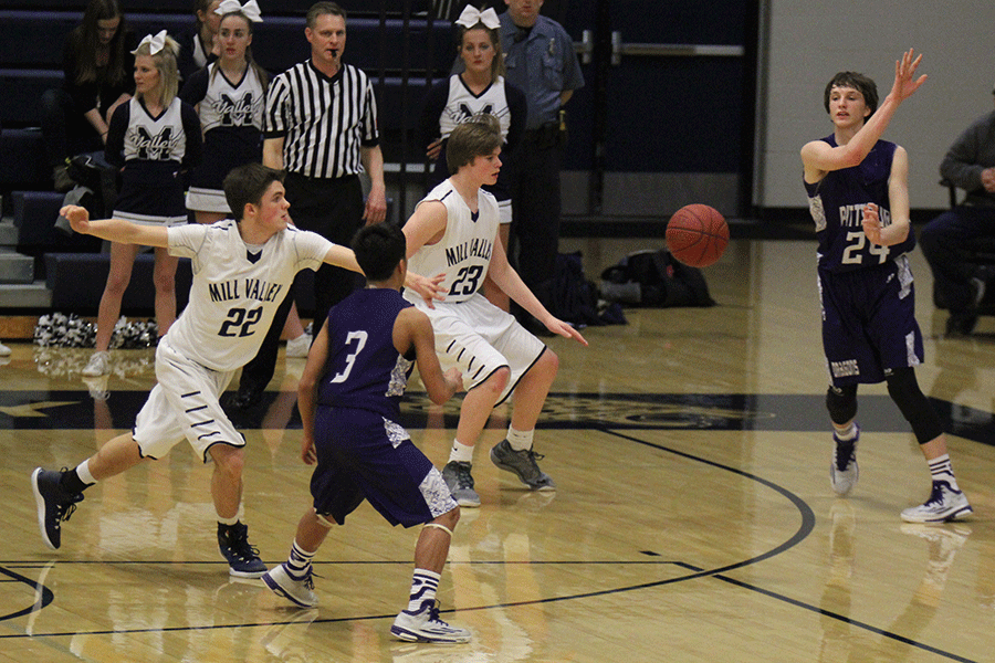 Junior Kasey Conklin attempts to steal the basketball from the opposing team. 