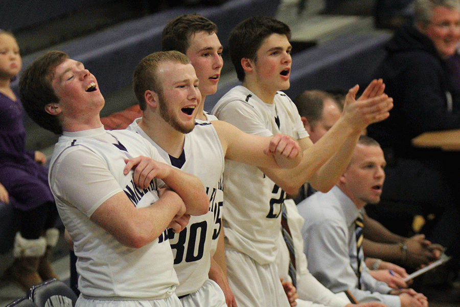 Seniors Connor Kaifes, and Mitch Perkins along with juniors Jason Widmer and Kasey Conklin react to a missed basket from a team member during the substate match-up against Pittsburg High School on Thursday, March. 5. 