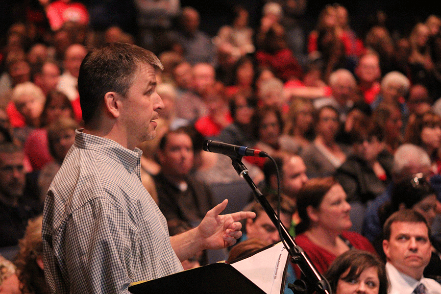 District resident Pete Panagakis speaks to the Board of Education in front of a large crowd who attended the Board meeting  on Monday, March 9. “You guys need to be holding each other accountable,” Panagakis said to the Board. “If [leaders are] not doing their job, then they need to answer why.” 