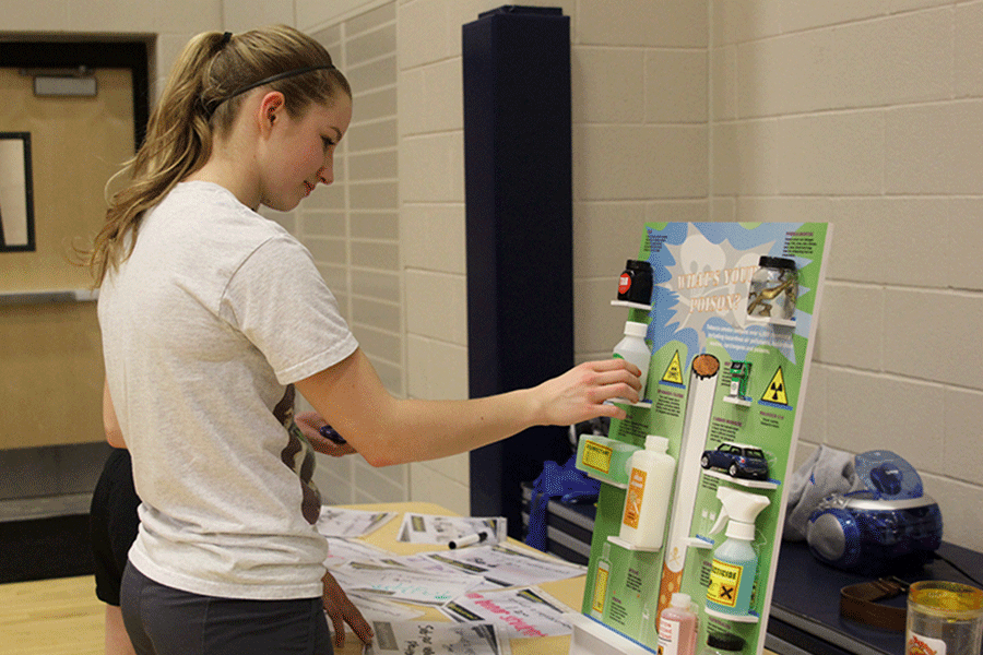 Senior Savannah Rudicel looks at a display featuring the toxic chemicals in a single cigarette on Wednesday, March 5. The night was dedicated to educating students on the effects of tobacco. 