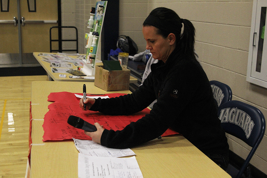 Physical education teacher Amy McClure kept track of wins and losses during the Kick Butts Day volleyball tournament on Wednesday, March 25. [My favorite part was] seeing the kids get excited about being tobacco free, McClure said.  