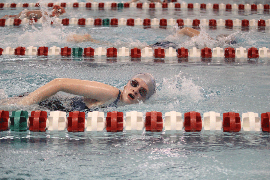On Monday, April 13, sophomore Emma Dandridge competes in her heat at Blue Valley West High School.