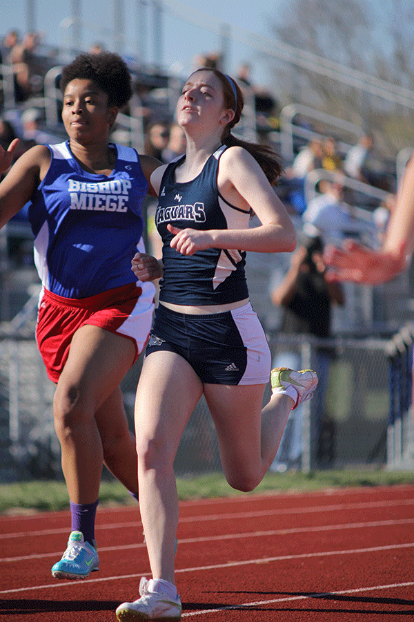 Junior Sally Carey competes in the 100 M sprints.
