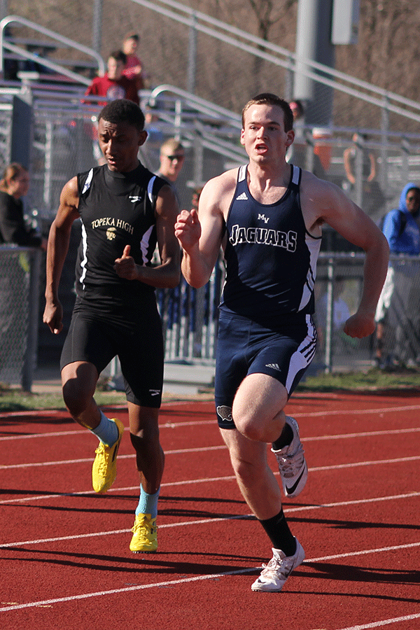 Junior Andrew Hicks competes in the 100 M sprints.
