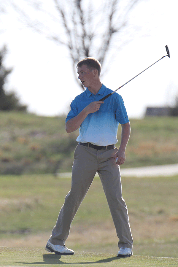 Senior Devan Thomas watches his ball.