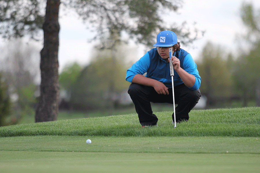 FILE PHOTO: Junior Koy Holden watches his golf ball at a meet on Monday, April 20, 2015.