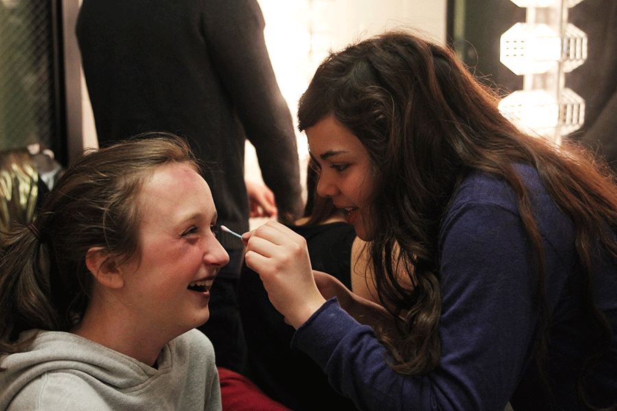 In preparation for junior Claire Biles role as a zombie in 10 Ways to Survive the Zombie Apocalypse, junior Madison Remijio applies eye makeup to create the illusion of bruised skin. The Triple One-Act Stravaganza is set to premiere on Tuesday, April 28.