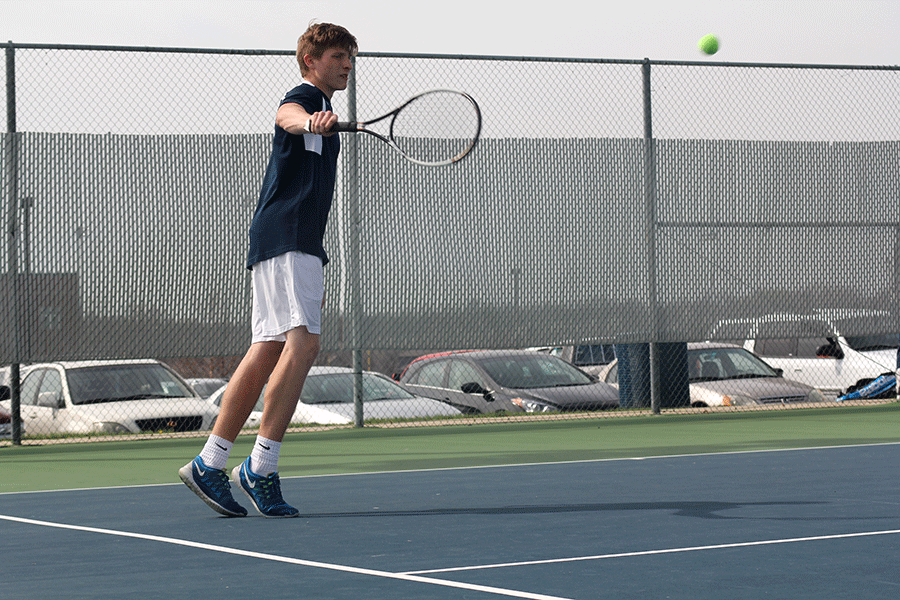 Junior Brock Miles backhands a ball on Wednesday, April 1.