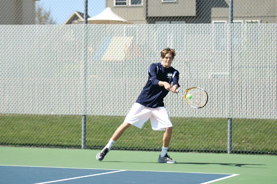 Sophomore Jansen McCabe returns a ball back to his opponent during an invitational on Wednesday, April 22.