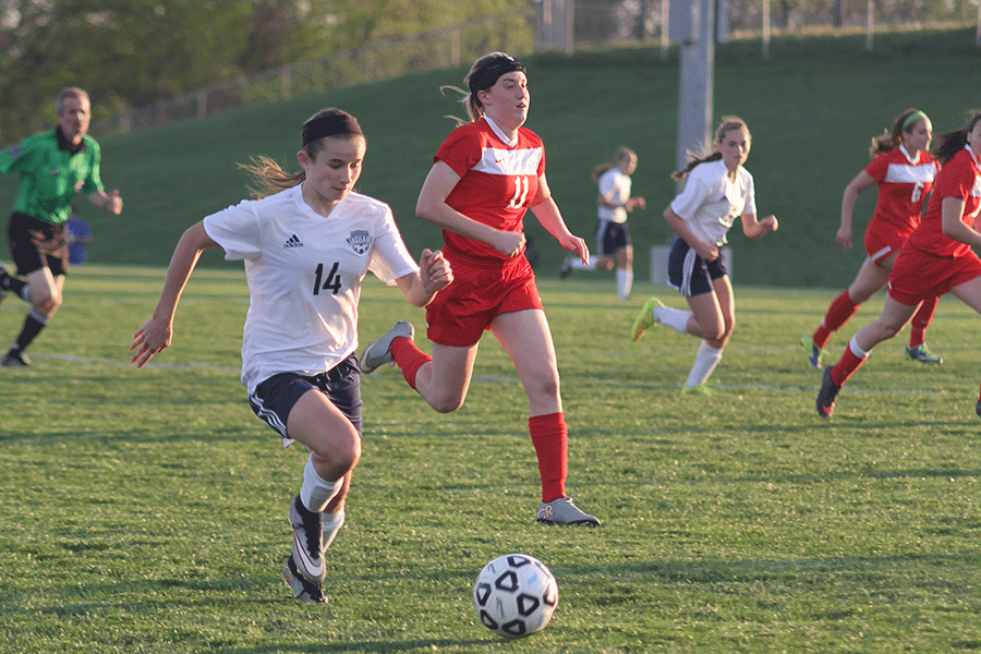 Junior Kennedy Hoffman dribbles the ball while attacking toward the goal.