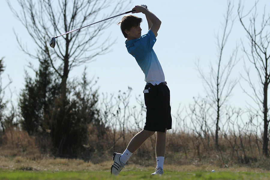 Arms above his head, senior Jack Casburn follows through after he took a shot on Monday, March 30.