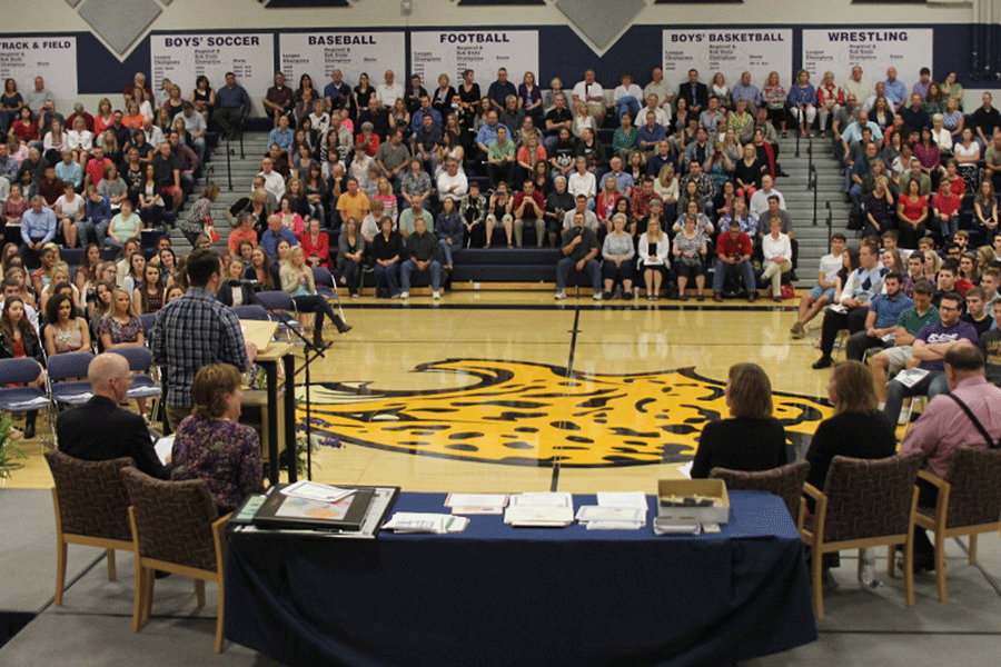 Introducing the honorary speaker at the senior graduation awards ceremony on Friday, May 15, senior class president Clayton Kistner makes a brief statement on how physical education teacher Travis Keal has made a positive impact on the seniors.