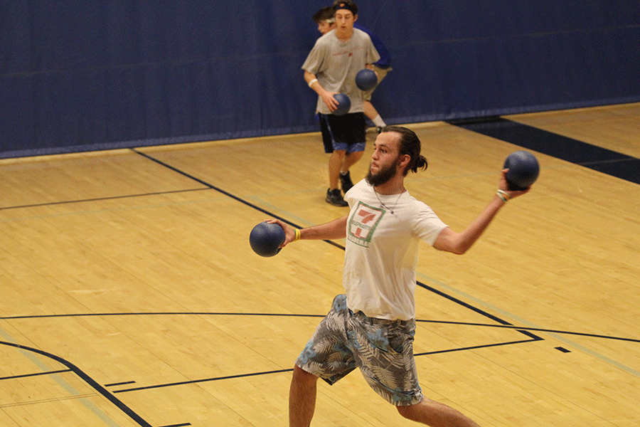 Senior Gabe Santos throws a ball during a dodgeball match.